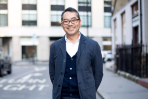 Headshot of David Sin. A middle aged man with glasses and dark hair.